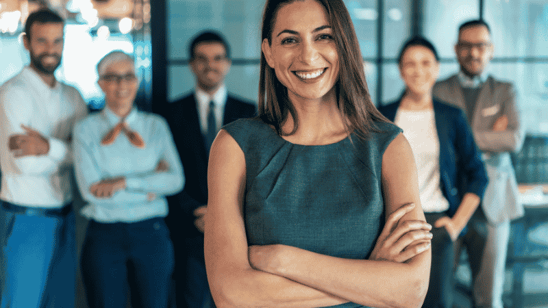 A professional marketing team happy that they found finance for a new marketing campaign.